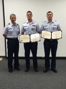 U.S. Coast Guard Petty Officers 3rd Class Kyle Camaiore and Jonathan McKinney, both aviation maintenance technicians stationed at Air Station Barbers Point, Hawaii, were awarded the Coast Guard Achievement Medal Oct. 3, 2016, for their heroic actions performed while attending flight engineer school in Tampa, Florida. Camaiore and McKinney saved a woman's life after witnessing a vehicle accident and improvising a tourniquet to stop blood loss. (U.S. Coast Guard photo)