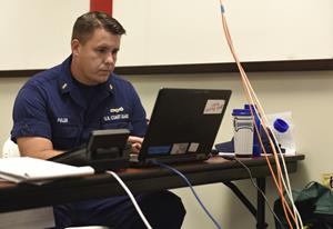 Coast Guard Chief Warrant Officer, Ryan Fuller, begins preparations at the incident command post at Air Station Miami, Sept. 8, 2017. The ICP was established in preparation to Hurricane Irma expected to affect the majority of south Florida. U.S. Coast Guard photo by Petty Officer 1st Class Mark Barney. 