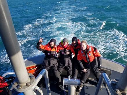 Rescued mariners aboard Coast Guard boat